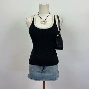 Black knit rib tank top with white trimming by rails